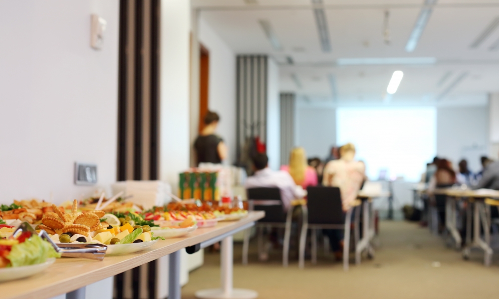 Lunch laid out with a presentation ongoing behind