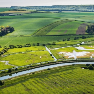 High and over side road view point near Seaford, East Sussex, England. View of Cuckmere river from above, selective focus