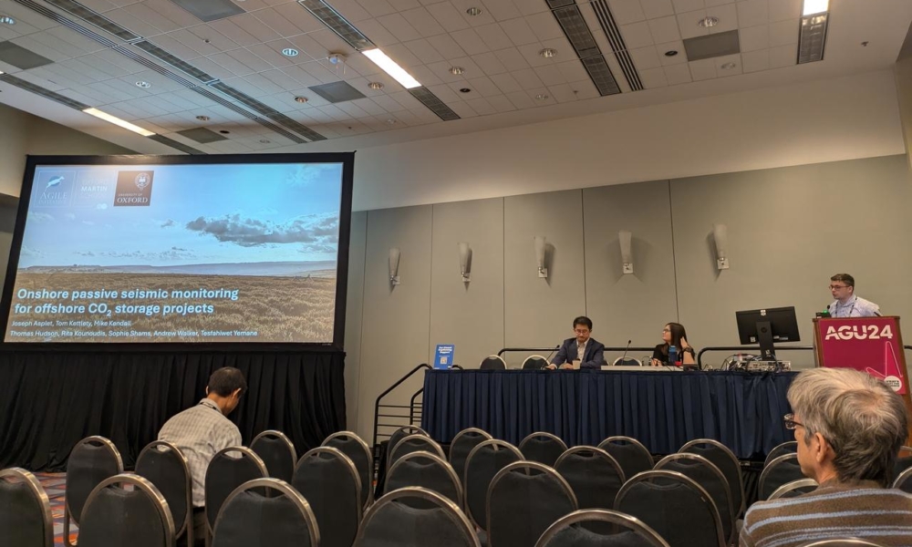 Joseph Asplet presenting at AGU in 2024.