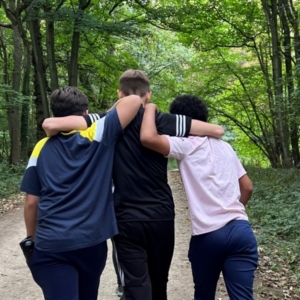 Three boys together in a forest